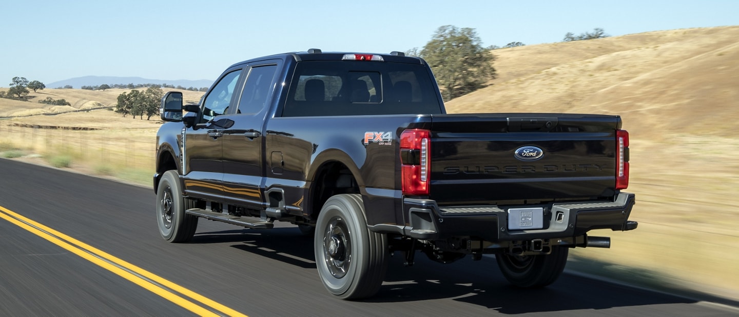 2023 Ford Super Duty® F-250® XL with STX Appearance Package being driven on a scenic road
