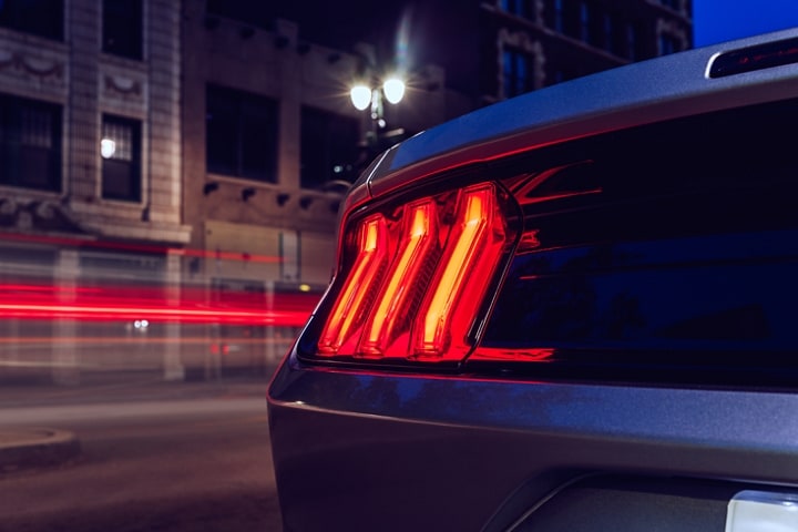 Close-up of a 2023 Ford Mustang® coupe turn signal at night