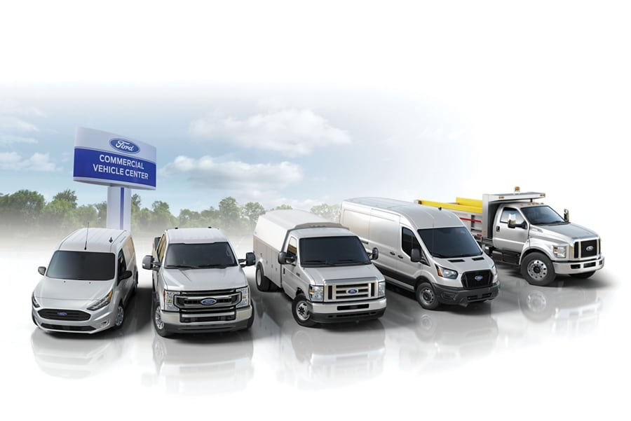 Ford commercial vehicle lineup parked at a Ford Commercial Vehicle Center