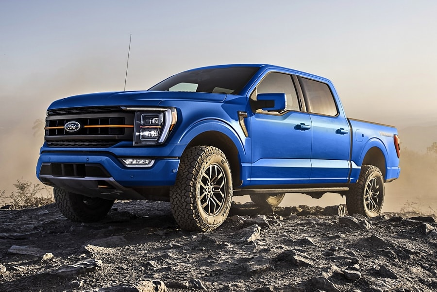 2022 F-150® Tremor® in Velocity Blue parked on a rocky trail