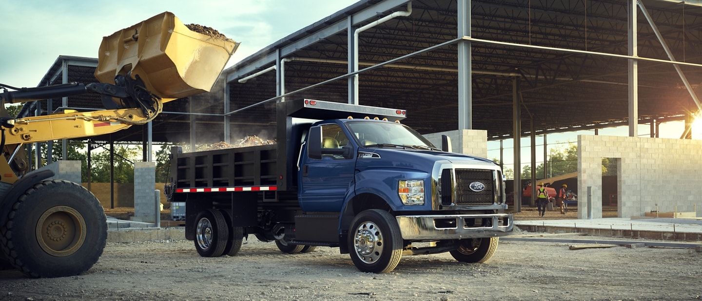 2024 Ford F-750 Regular Cab in Blue Jeans with dump truck upfit at work site