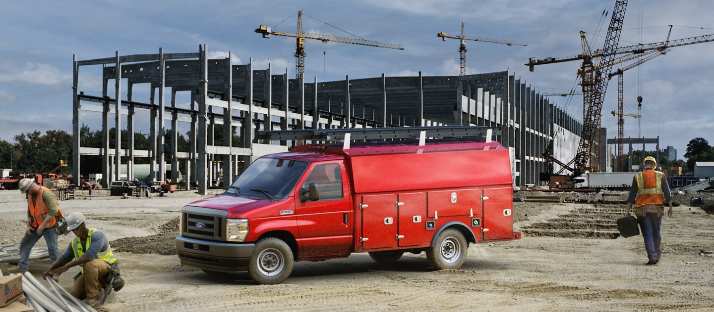 2024 Ford E-Series Cutaway with drive upfit parked at construction site