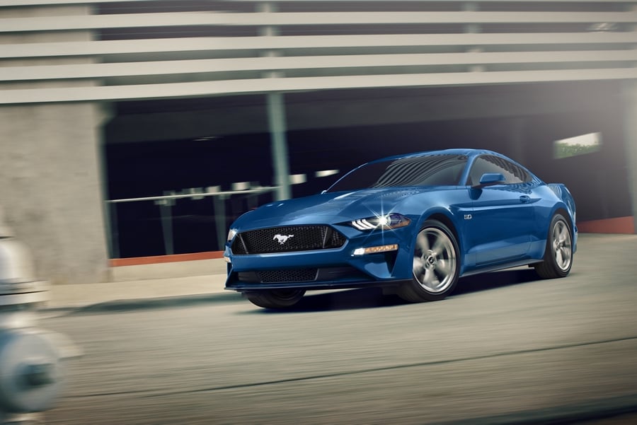 A 2023 Ford Mustang® coupe being driven out of a parking garage