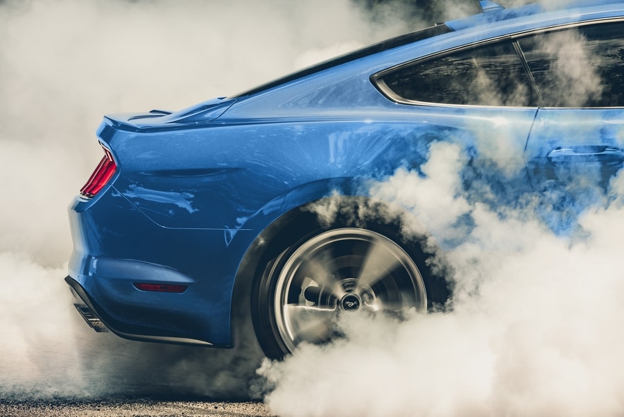 A 2023 Ford Mustang® coupe performing a burnout