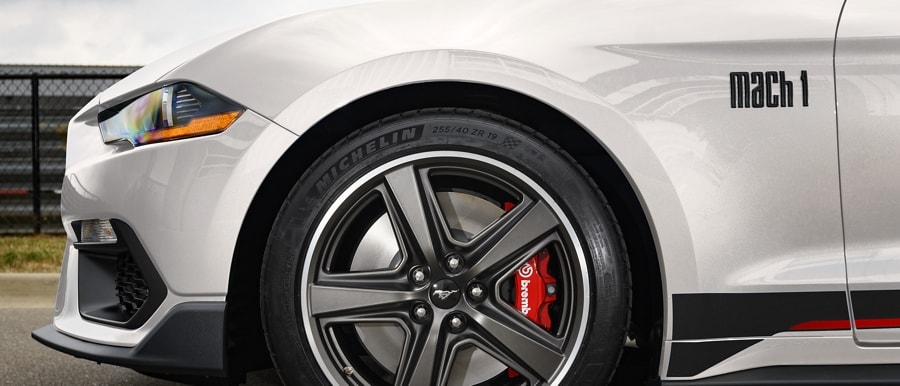 Close-up of 2023 Ford Mustang® Mach 1® coupe front wheel showing Brembo™ brake on larger caliper