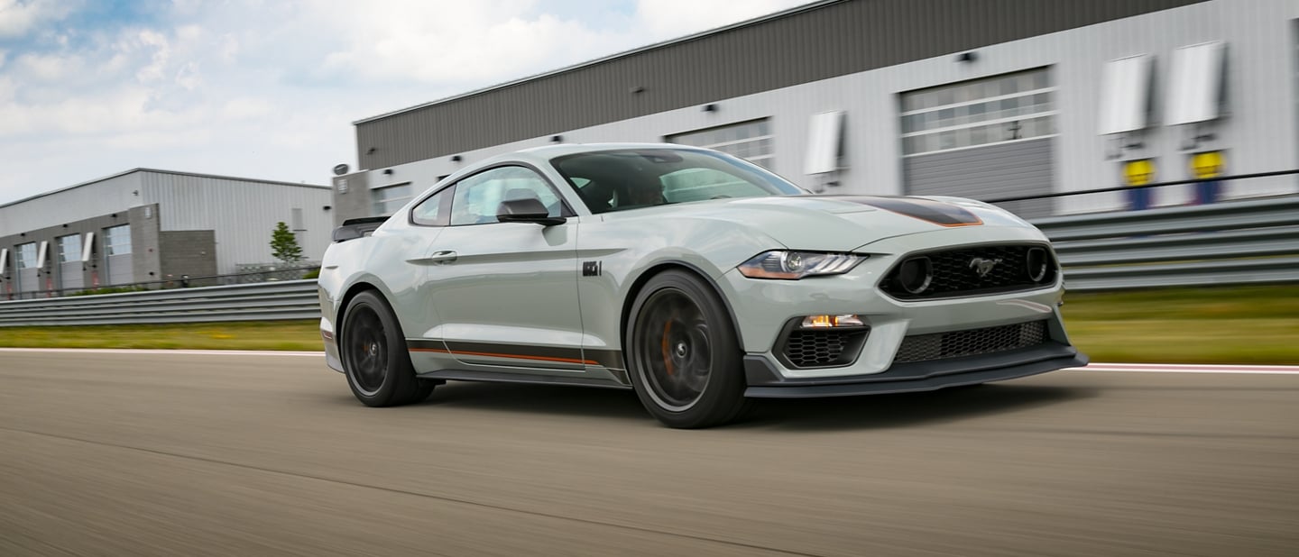 A 2023 Ford Mustang® Mach 1® coupe being driven on a track