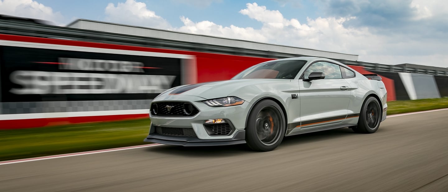 A 2023 Ford Mustang® Mach 1® coupe being driven on a racetrack