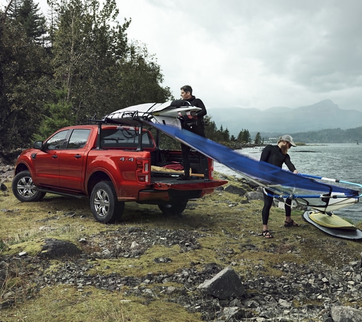 2023 Ford Ranger® FX4 SuperCrew® shown in Hot Pepper Metallic being loaded with surf gear