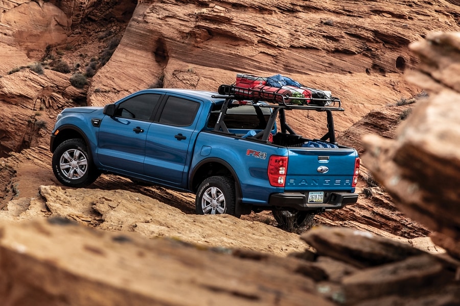 2023 Ford Ranger® XLT FX4 in Velocity Blue parked on rocks