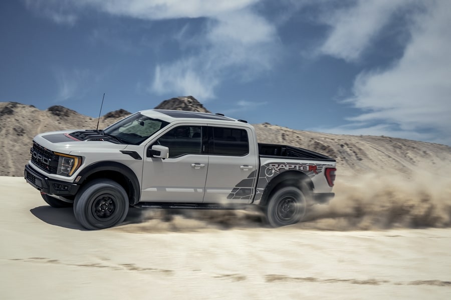 2023 Ford Raptor R™ being driven on a sand dune