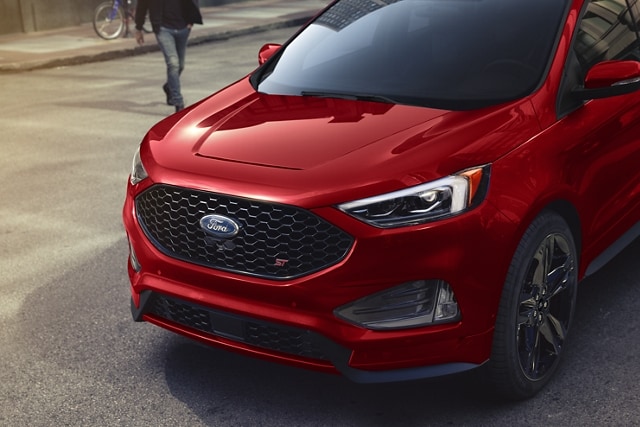 Three-quarter view of the front of a 2023 Ford Edge® ST SUV in Rapid Red
