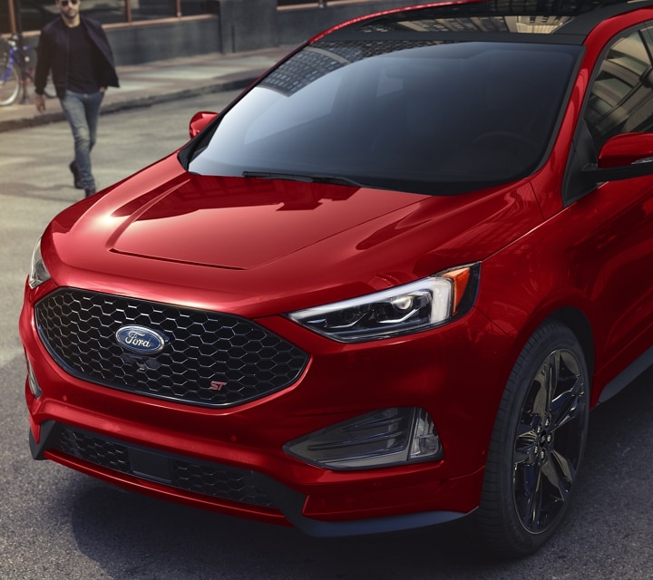 Front shot of a 2024 Ford Edge® ST model in Rapid Red