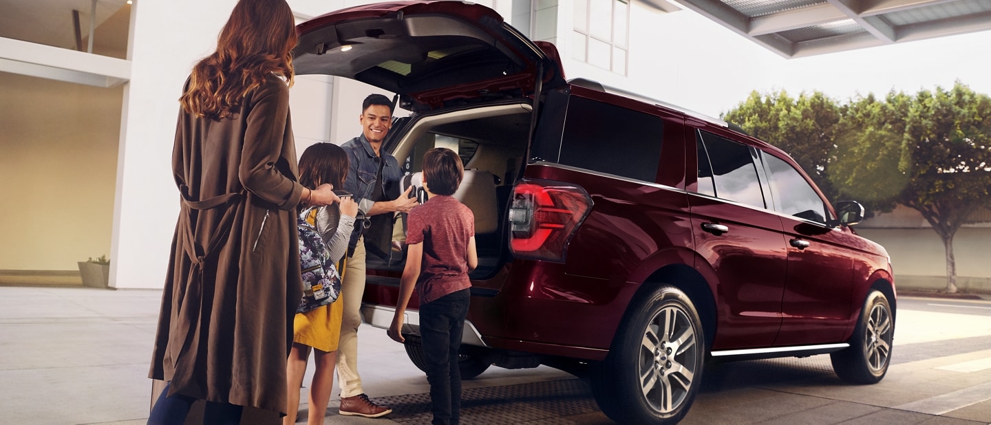 A family loads up the back of a 2024 Ford Expedition
