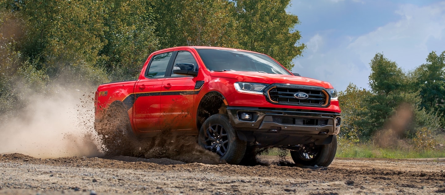 2023 Ford Ranger® Splash Package in race red driving through mud