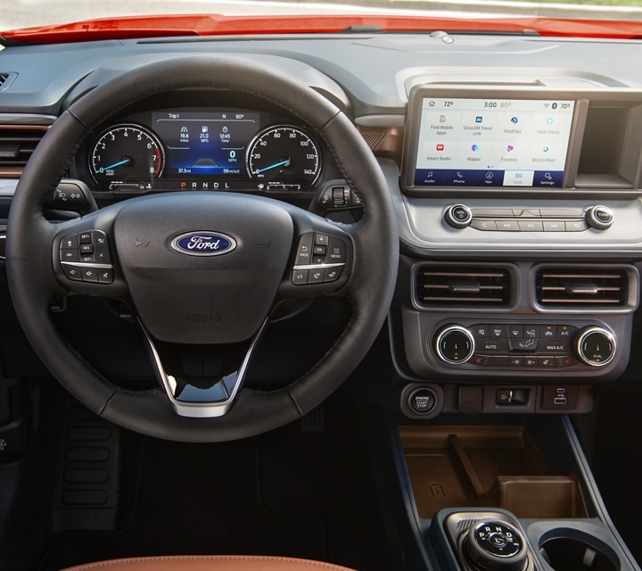 A close-up of the steering wheel and dash of a 2024 Ford Maverick® truck