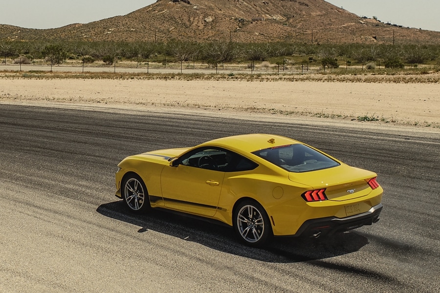 2024 Ford Mustang® EcoBoost® coupe being driven on a desert road