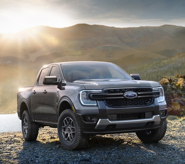 A 2024 Ford Ranger® in Carbonized Gray is parked in a scenic location