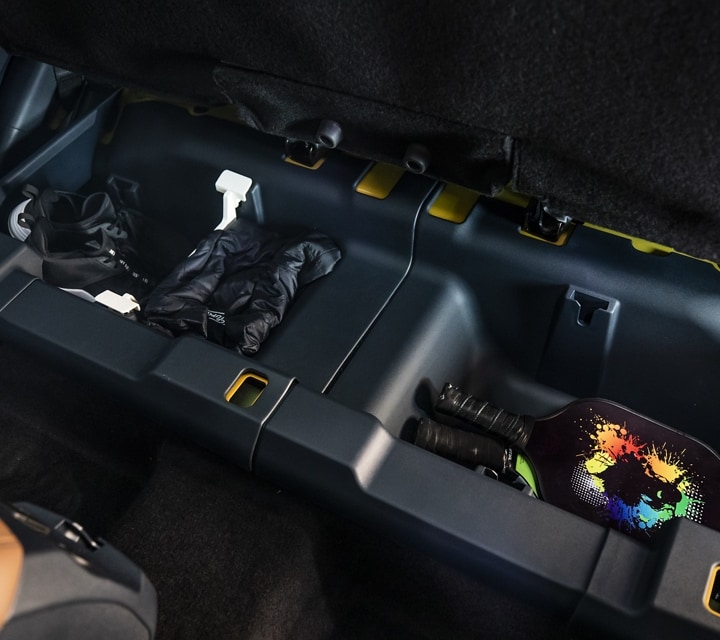 Rear under-seat storage bins inside a 2023 Ford Maverick® truck