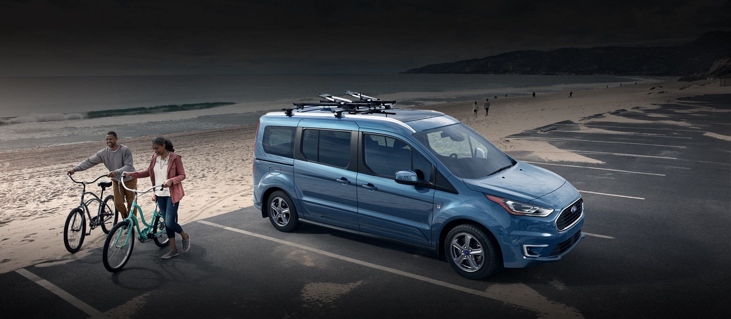 2023 Ford Transit Connect Passenger Wagon in Blue metallic parked by the beach