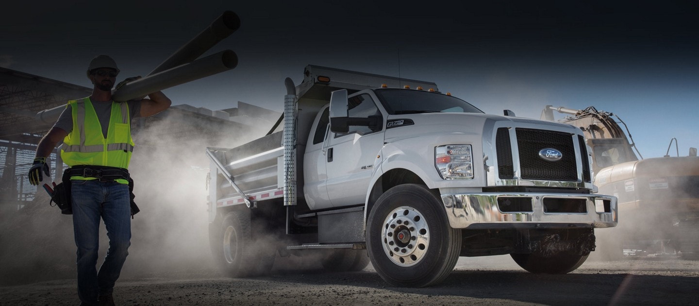 2024 Ford F-750 Diesel Super Cab in Oxford White with aftermarket dump equipment at a construction site