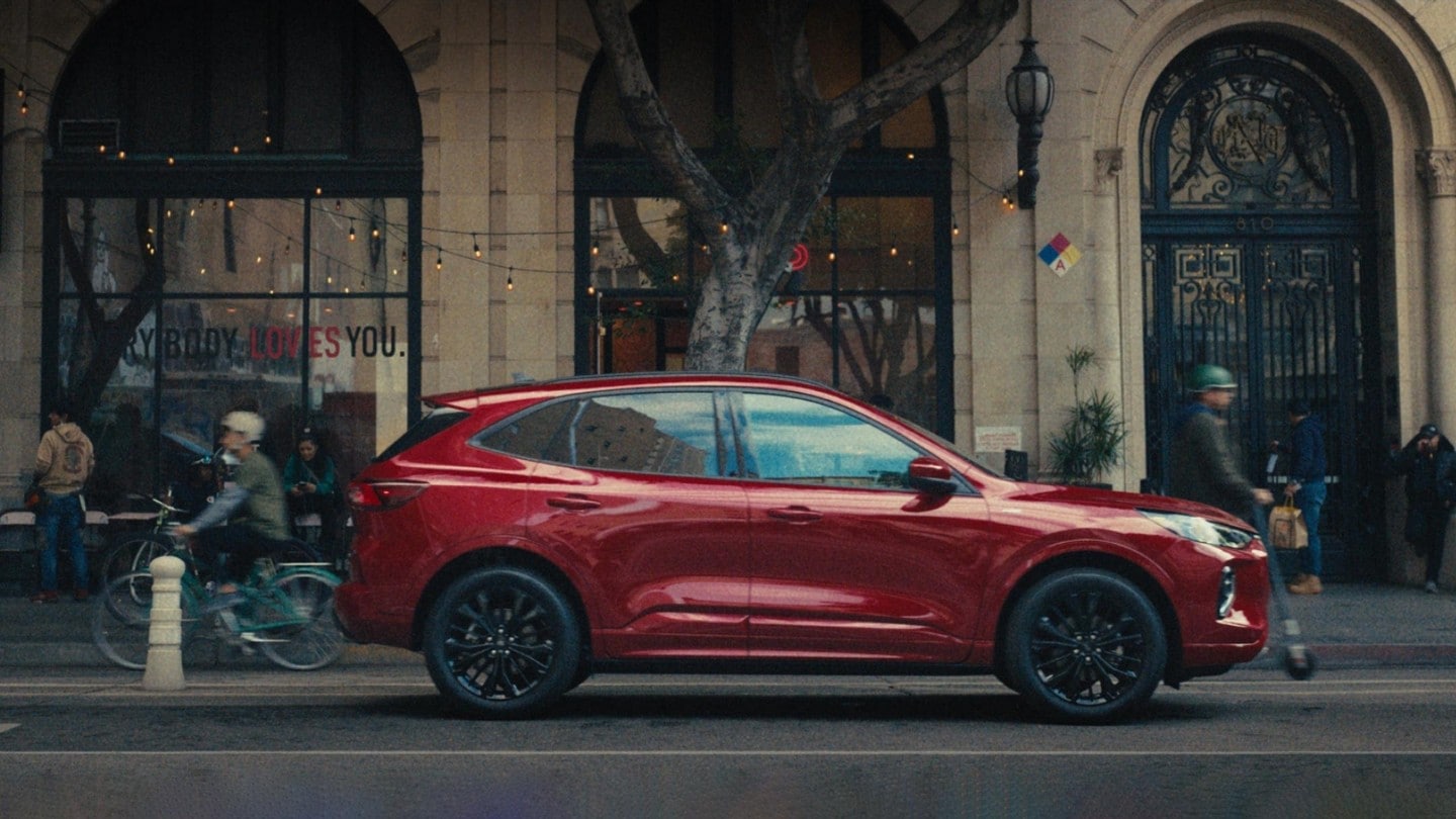 A 2023 Ford Escape® parked in front of a building in an urban setting.