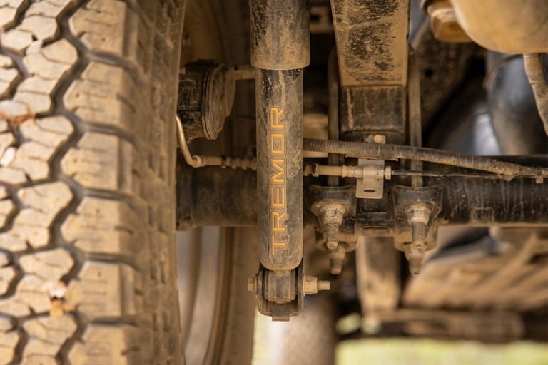 Close-up of the shocks on 2022 Ford F-150® Tremor® logo on rear