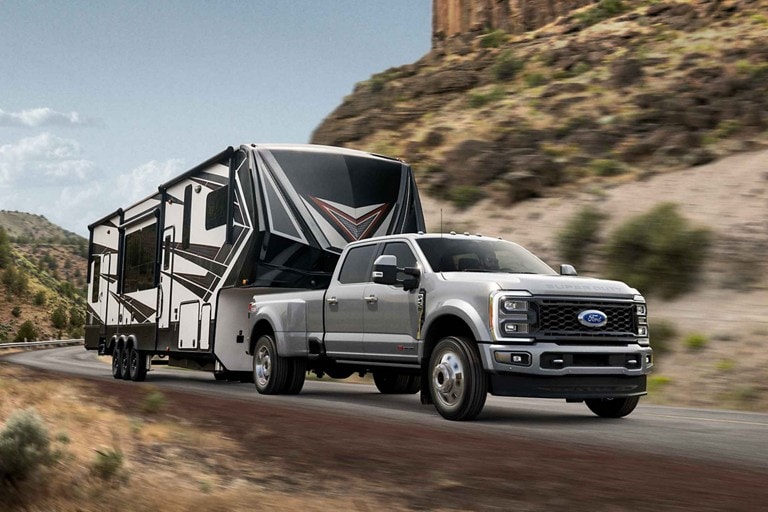 2023 Ford Super Duty® F-450® Limited pulling a camper trailer
