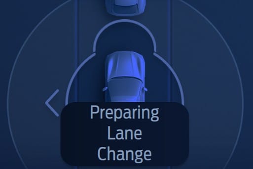 Graphic in the cluster display of a Ford Mustang Mach-E showing a vehicle preparing a lane change.