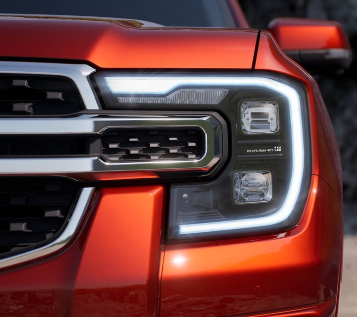 Close-up of a LED headlamp on a 2024 Ford Ranger® in Hot Pepper Red extra cost option